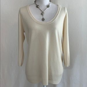 Gorgeous cream sweater with trimmed neckline.